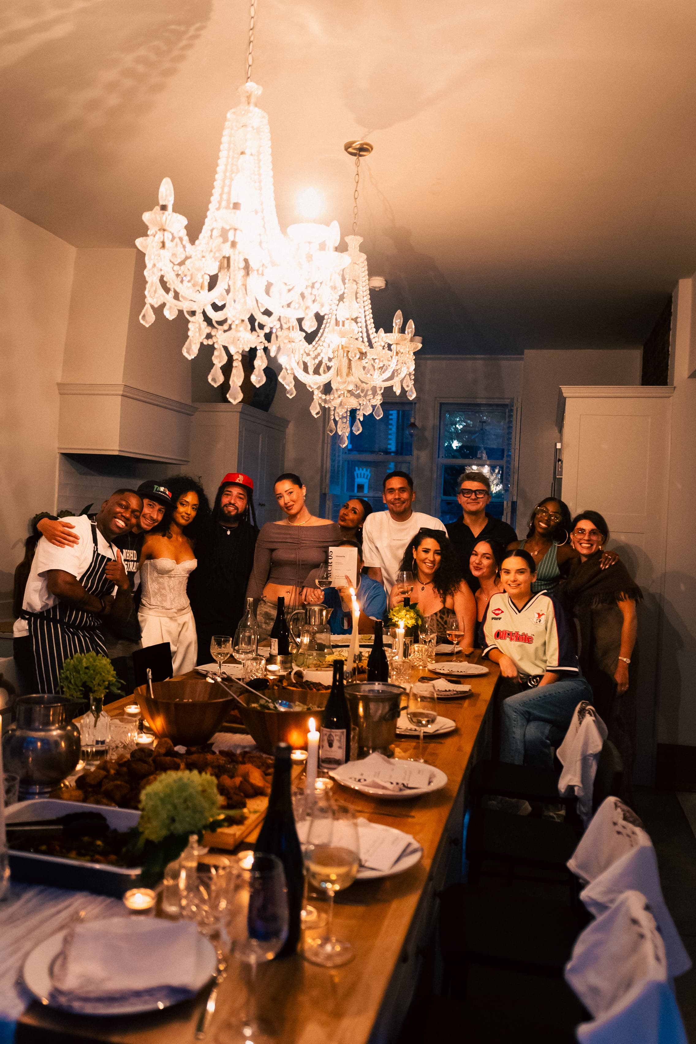 Guests gathered together behind a shared dinner table